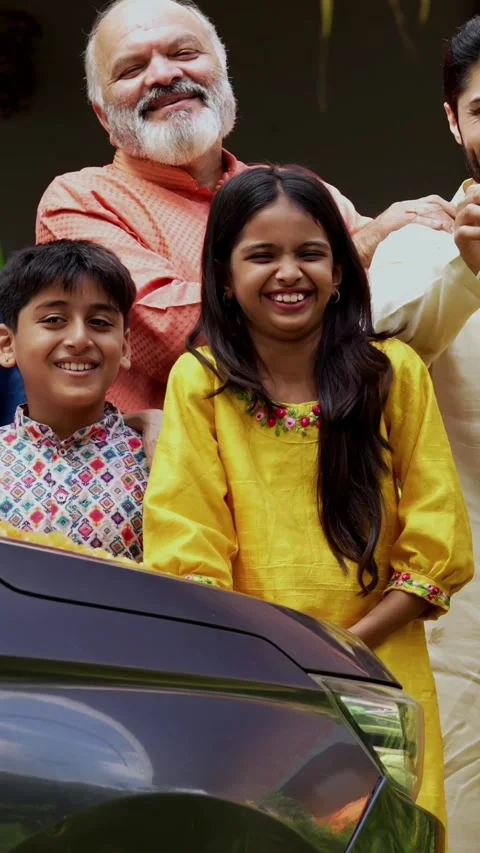 Performing car puja together, Indian family of six celebrating new vehicle Stock-Footage 342839120