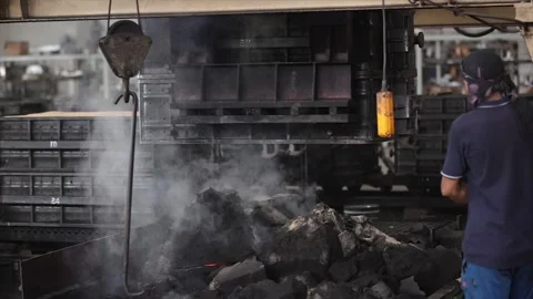 Performing crucial sand casting operations on a production line Stock Footage 320946845