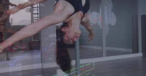 Performing dancer in black sportswear executing inverted pole in dance studio, Stock Photos