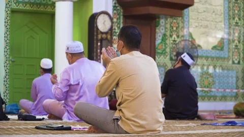 Performing Friday prayer in mosque during pandemic in KL Stock Footage 142041263