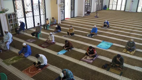 Performing Friday prayer in mosque during pandemic in KL Stock Footage 142041329