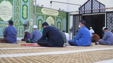 Performing Friday prayer in mosque during pandemic in KL Stock Footage 142041397