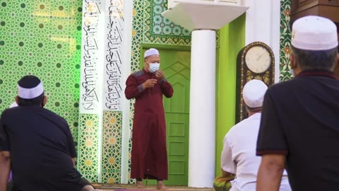 Performing Friday prayer in mosque during pandemic in KL Stock Footage 142041446