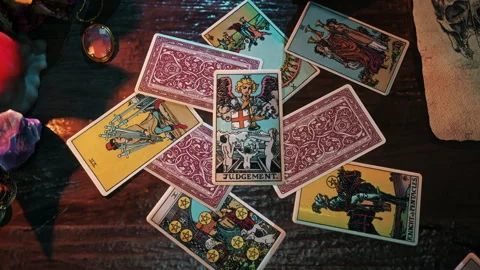 Performing the medieval regal esoteric focus using The Judgement Tarot Card Stock Footage 251183851