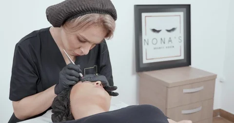 Performing a procedure of tattoo removal using manual tools Stock Footage 103792636