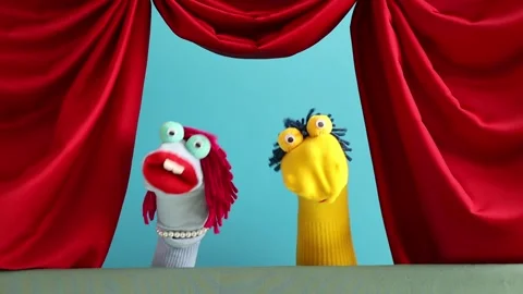 Performing puppet show on stage with red curtains Stock Footage 306178693