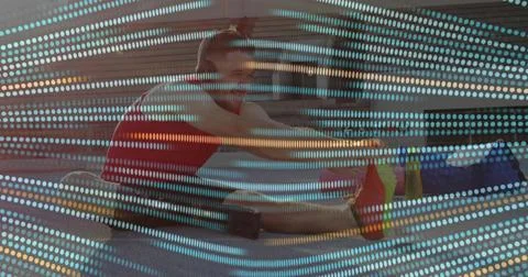 Performing seated hamstring stretch man in bright red tank top on urban plaza 写真素材