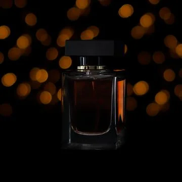 Perfume with bokeh Stock Photos