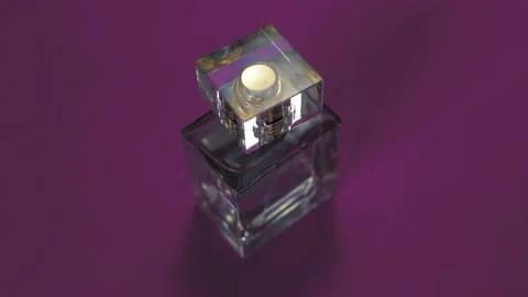 Perfume bottle and shining light flares on pink background Stock-Footage 147971069