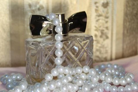 Perfume bottle on a background Stock Photos