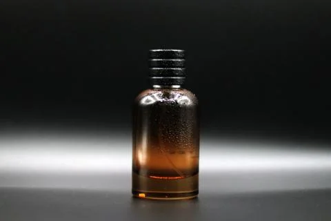 Perfume bottle with black background Stock Photos