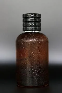 Perfume bottle with black background Stock Photos