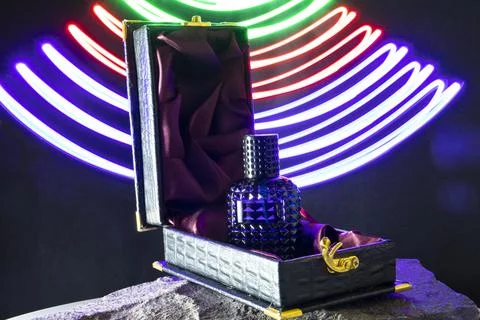 Perfume Bottle in black background Stock Photos