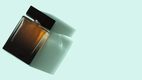 Perfume bottle on blue background Foto stock