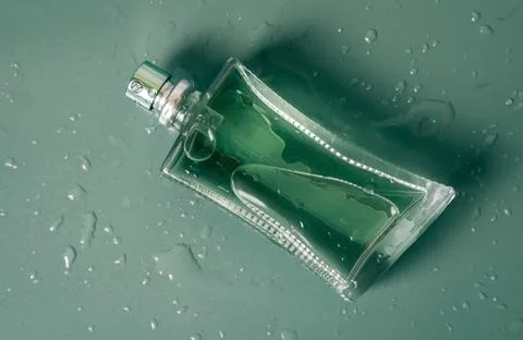 Perfume bottle closeup with drops Stock Photos