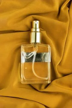 Perfume bottle on fabric Fotos Stock