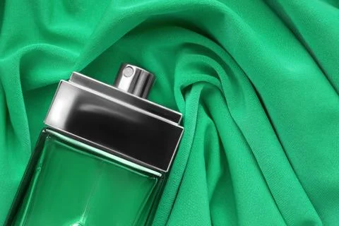Perfume bottle on fabric Fotos Stock