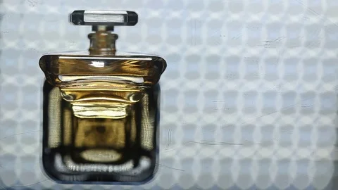 Perfume bottle with golden cap Stock Footage 70779820