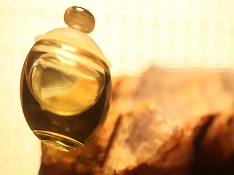 Perfume bottle with golden cap Stock Footage 70781357