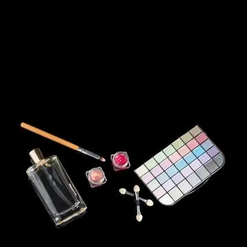 Perfume bottle, makeup brushes, make-up eye shadows palette and lipsticks. Fa Stock Photos