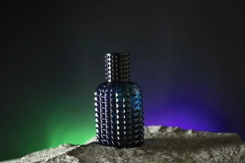 Perfume bottle. Mockup on the dark or black empty background. Stock Photos