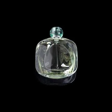 Perfume bottle with reflection on black background. Perfumery, cosmetics. Photos