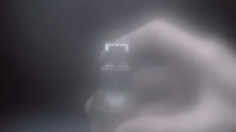 From perfume bottle the spirits fly straight into the camera. Slow mo, slo mo Stockbeeldmateriaal 64700746
