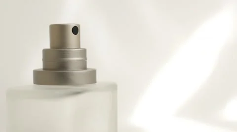 Perfume bottle sprayer  in front of white background slow tilting 4K 2160p Ul Stock-Footage 50894473
