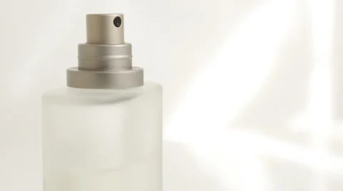 Perfume bottle sprayer  in front of white background  tilting 4K 2160p UltraH Stockbeeldmateriaal 50897012