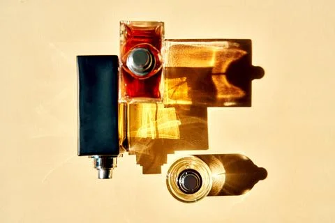 Perfume bottles creating abstract shadows and light reflections Photos