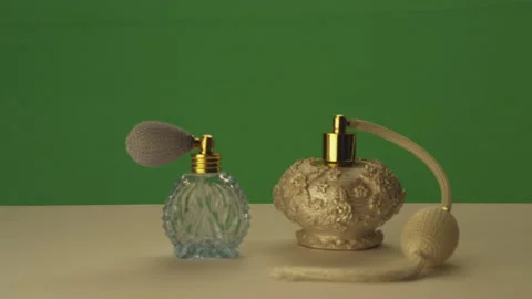 Perfume bottles on greenscreen Stock Footage 146357616