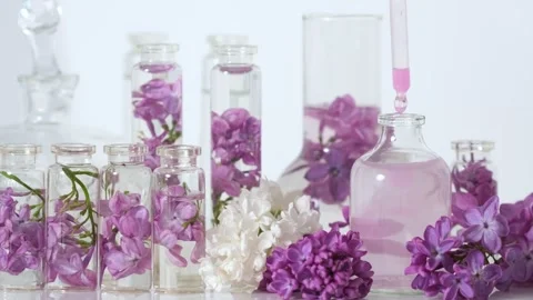 Perfume Bottles with Lilac Blossoms Stock-Footage 331350510