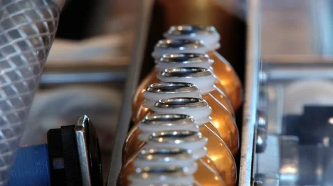 Perfume bottles move being filled at the production  line. Video stock 61395272
