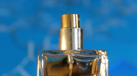 Perfume - in focus - blue background 02 Vídeo Stock 61866498