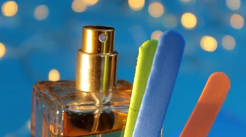 Perfume - in focus - blue background 06 Vídeo Stock 61866504