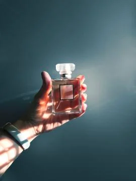 Perfume jar sample in a hand Stock Photos