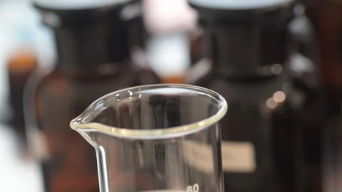 Perfume making process of dropping raw materials and blending into a flask Stock Footage 329165120