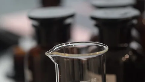 Perfume making process of dropping raw materials and blending into a flask Видео 329165145