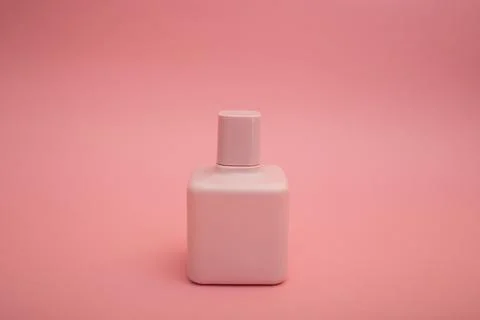 Perfume on a pink background Stock Photos
