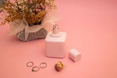 Perfume on a pink background Stock Photos