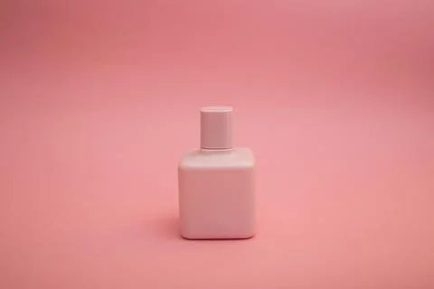 Perfume on a pink background Stock Photos