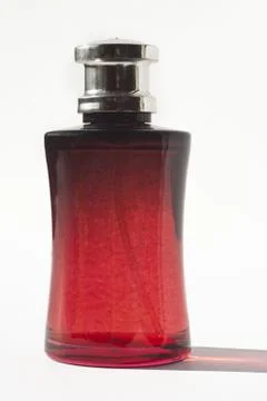 Perfume in red bottle Stock Photos