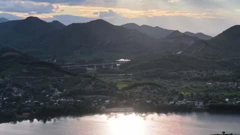 Perfume River valley at dusk with mountain backdrop aerial 4K Stock Footage 339863632