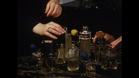 Perfume shop, close up of various perfume bottles, Paris, 1970 Video stock 85873744