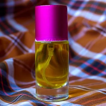 Perfume on a two-tone plaid background Stock Photos