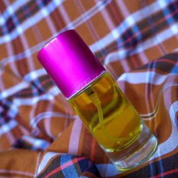 Perfume on a two-tone plaid background Stock Photos