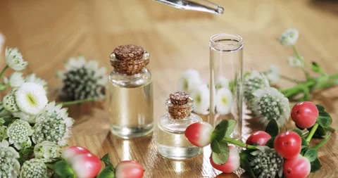 Perfumer making aroma parfume pouring essential oil pipette to glass bottle. Stock Footage 127735264