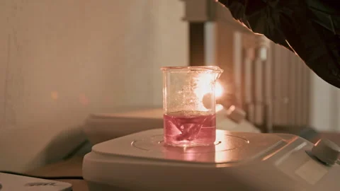 Perfumer Mixing Fragrance Ingredients in Laboratory Beaker Stock-Footage 337112341