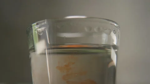 Perfumer pouring drops of oily scent into perfume in a glass. Process of Video stock 170614041