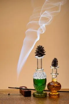 Perfumes and smoke Stock Photos
